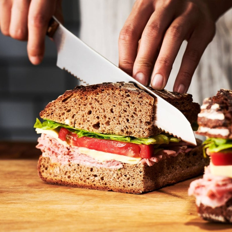 Hand cutting a sandwich with NAGOMI Bread Knife 205mm by Mitsuboshi Cutlery