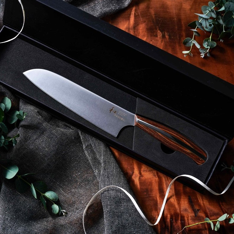 NAGOMI Santoku Knife 180mm crafted by Mitsuboshi Cutlery in black box on a wooden table