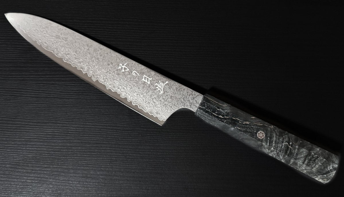 Omoi Gyuto stainless steel Kitchen Knife 180mm With Decorative Accent in the handle crafted by Nenohi Cutlery on black background