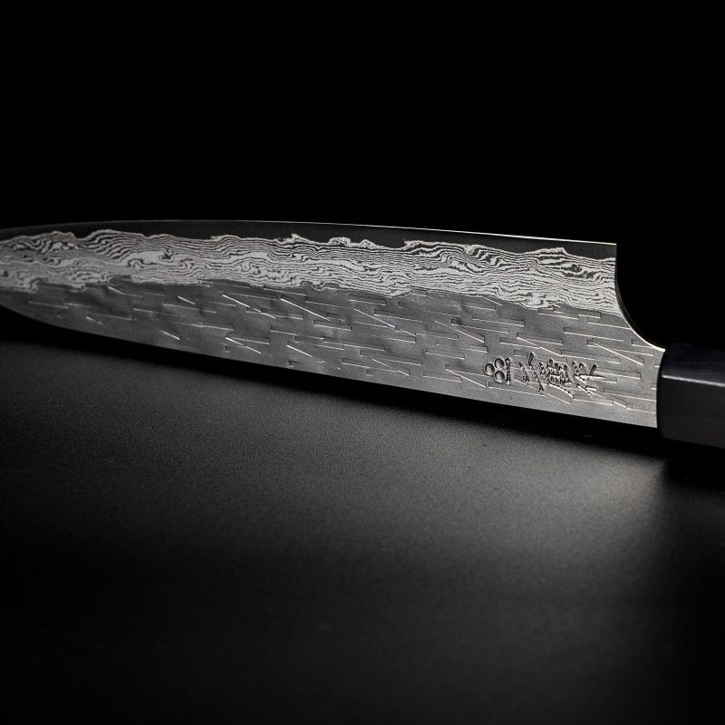 Closeup of engraving, ebony handle and buffalo horn ferrule on VG XEOS Petty Knife 16cm by Nigara Hamono