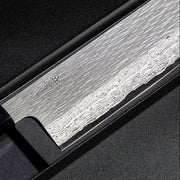Closeup on engraving on blade of VG XEOS Nakiri Knife 18cm crafted by Nigara Hamono in box