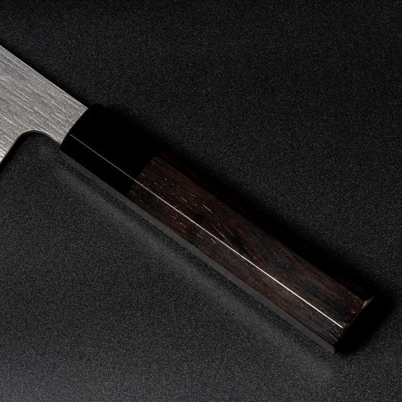 Closeup on ebony handle with buffalo horn ferrule on VG XEOS Nakiri Knife 18cm crafted by Nigara Hamono