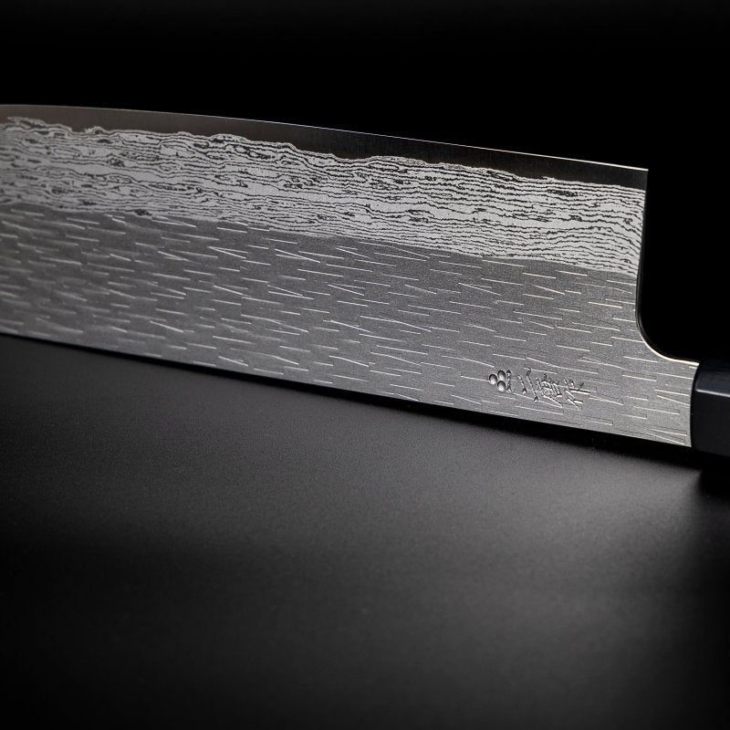 Closeup on engraving on blade of VG XEOS Nakiri Knife 18cm crafted by Nigara Hamono
