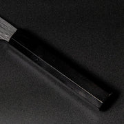 Closeup on ebony handle with buffalo horn ferrule on VG XEOS Santoku Knife 18.5cm crafted by Nigara Hamono 
