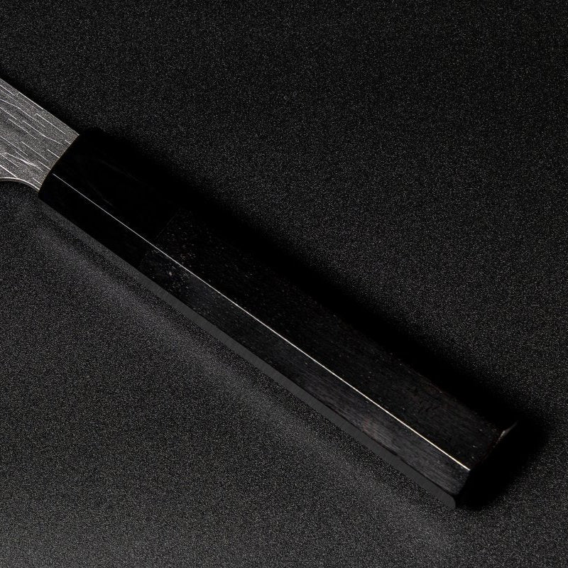 Closeup on ebony handle with buffalo horn ferrule on VG XEOS Santoku Knife 18.5cm crafted by Nigara Hamono 