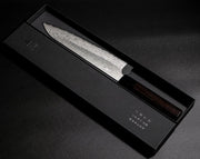 VG XEOS Gyuto Knife 22.5cm crafted by Nigara Hamono in elegant box on black background