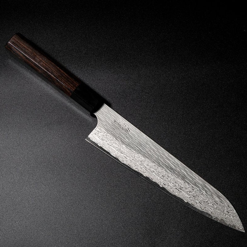VG XEOS Gyuto Knife 22.5cm crafted by Nigara Hamono on black background arranged diagonally