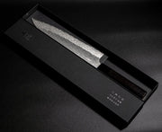 VG XEOS Gyuto Knife 25.5cm crafted by Nigara Hamono in elegant box on black background