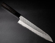 VG XEOS Gyuto Knife 25.5cm crafted by Nigara Hamono arranged diagonally on black background