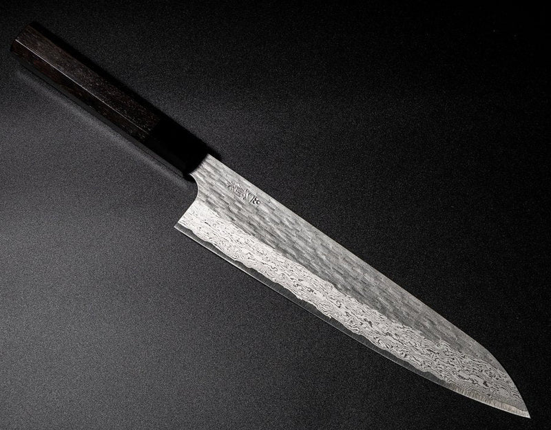 VG XEOS Gyuto Knife 25.5cm crafted by Nigara Hamono arranged diagonally on black background
