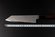 Blade of Sakai TAKAYUKI Kiritsuke 180mm by Aoki Hamono over a measure tape that shows the length of the blade