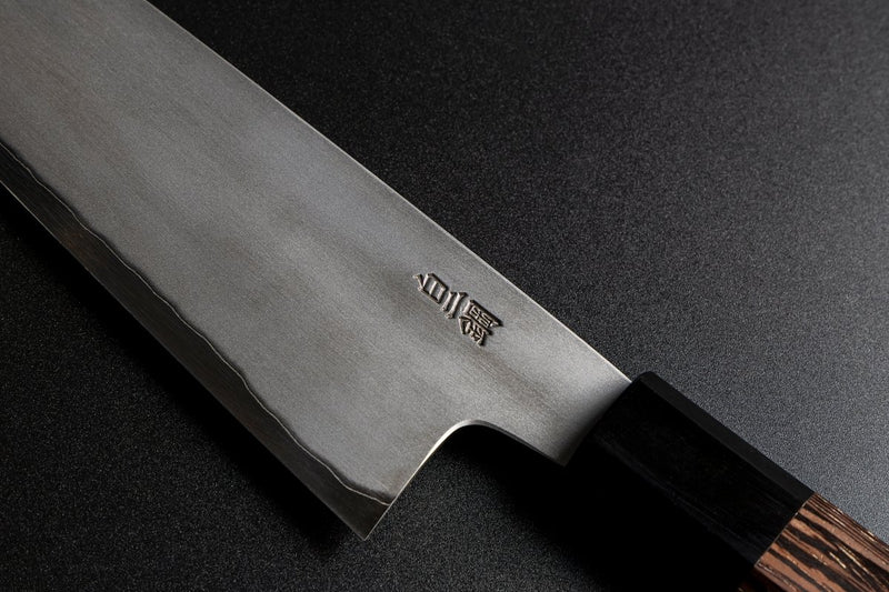 Close-up of the steel used, Shiwogami No.2, in Japanese characters on the left side of the blade of a Sakai TAKAYUKI Gyuto 210mm by Aoki Hamono