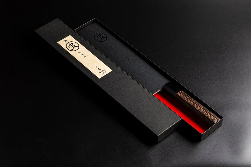 Sakai TAKAYUKI Kiritsuke 180mm by Aoki Hamono with a protective black balde cover in an open box with red inner side and Japanese characters label in the cover