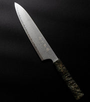 Omoi Gyuto stainless steel Kitchen Knife 180mm crafted by Nenohi Cutlery arranged diagonally on black background