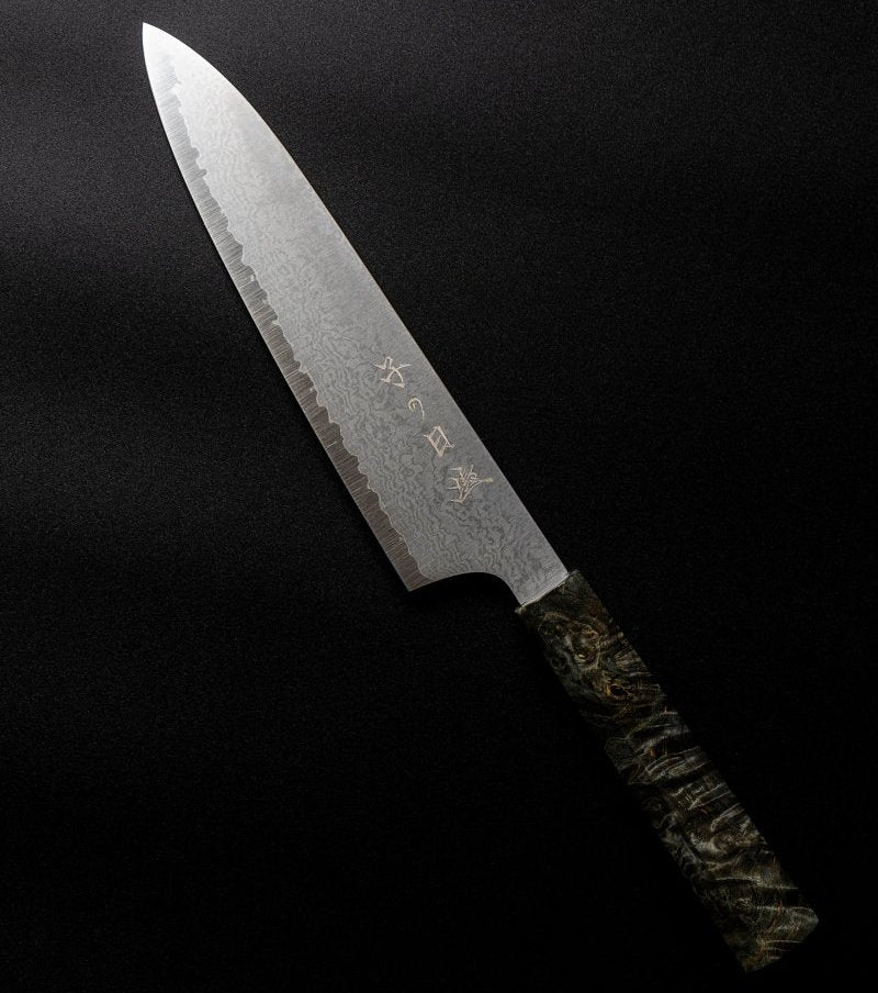 Omoi Gyuto stainless steel Kitchen Knife 180mm crafted by Nenohi Cutlery arranged diagonally on black background