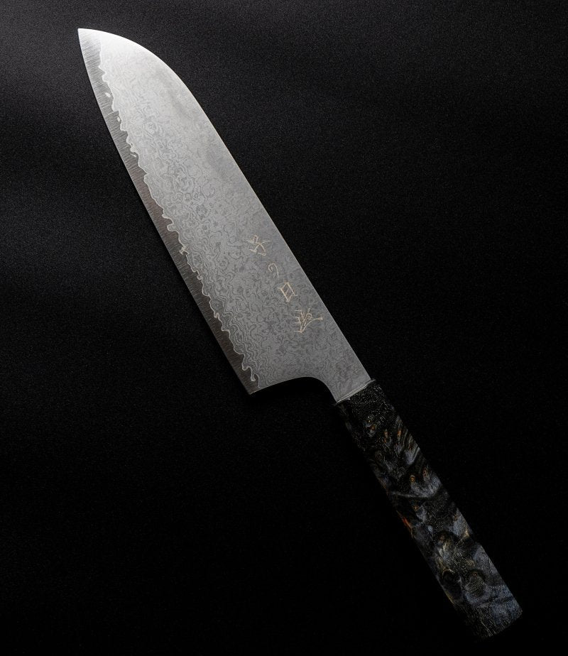 Omoi Santoku stainless steel Kitchen Knife 180mm crafted by Nenohi Cutlery arranged diagonally on black background