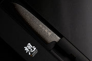 Omoi Gyuto Kitchen Knife 180mm crafted by Nenohi Cutlery in black box next to box cover with Omoi Made in Japan zoomed in