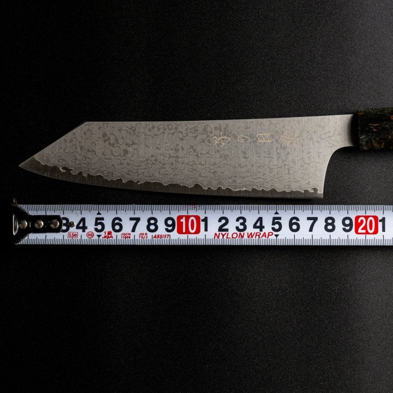 Omoi Kiritsuke Santoku Kitchen Knife 180mm crafted by Nenohi Cutlery with ruler showing the blade measures 18cm