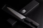 Omoi Gyuto stainless steel Kitchen Knife 180mm crafted by Nenohi Cutlery in sophisticated black box arranged in cross pattern