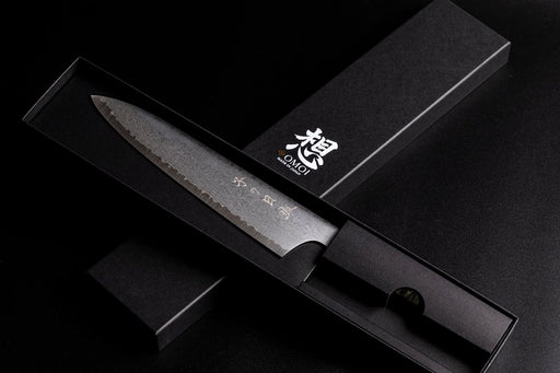 Omoi Gyuto stainless steel Kitchen Knife 180mm crafted by Nenohi Cutlery in sophisticated black box arranged in cross pattern