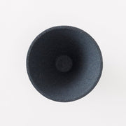 Aerial view inside black Ceramic Coffee Filter COFIL flow on white background