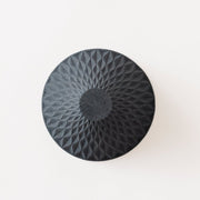 View of bottom of black Ceramic Coffee Filter COFIL flow on white background