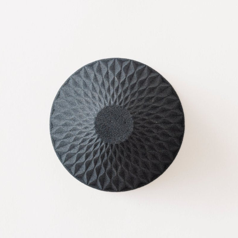 View of bottom of black Ceramic Coffee Filter COFIL flow on white background