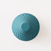 View of bottom of blue Ceramic Coffee Filter COFIL flow on white background