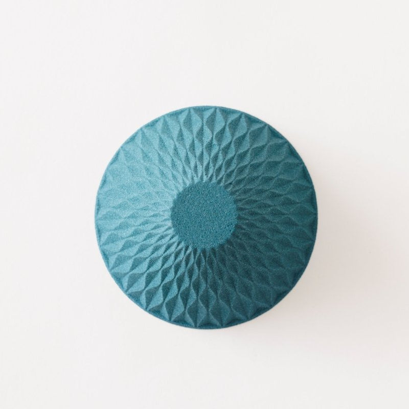 View of bottom of blue Ceramic Coffee Filter COFIL flow on white background