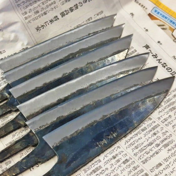 Shigemitsu Hamono blades fresh from the forge on newspaper
