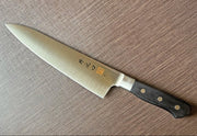 Western-Style Santoku Kitchen Knife 21cm crafted by Inoguchi Hamono in Seki, Japan on brown background