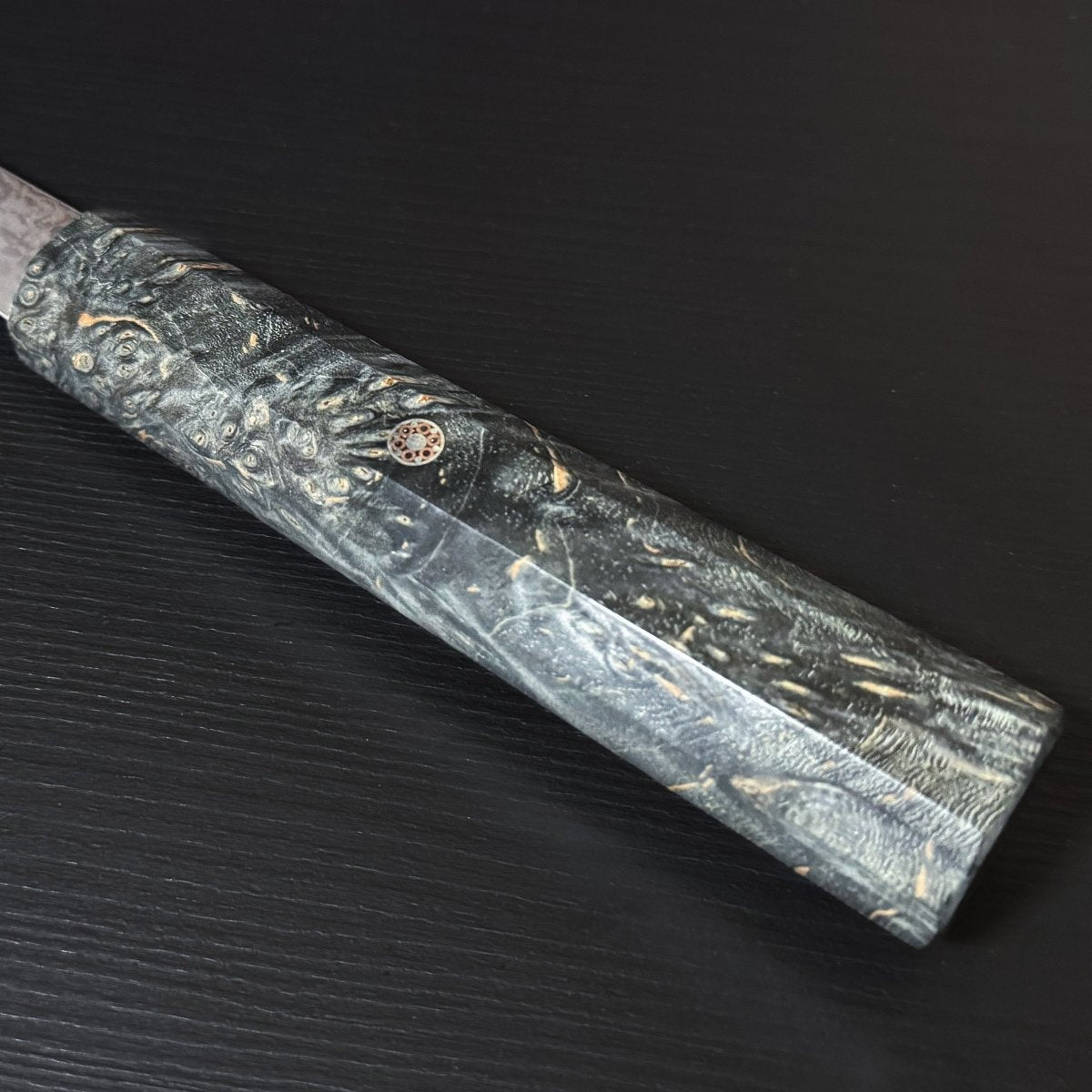 Close-up pf the handle with decorative accent of Omoi Santoku stainless steel Kitchen Knife 180mm crafted by Nenohi Cutlery