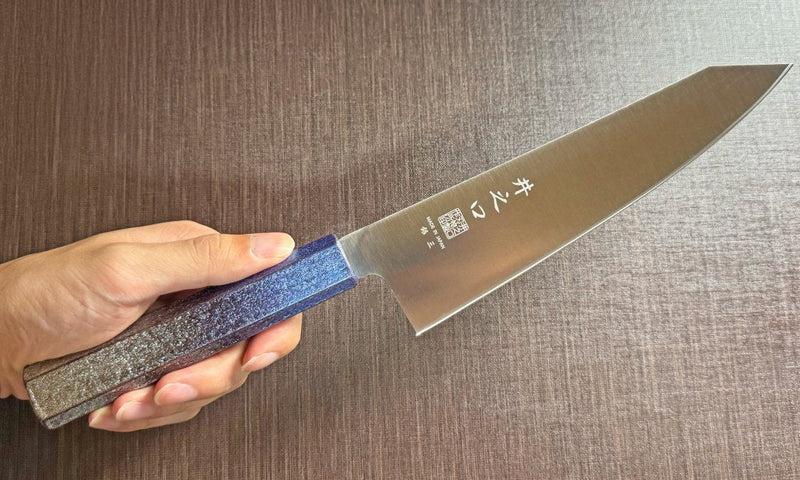 Japanese-style Kiritsuke Santoku Kitchen Knife 21cm crafted by Inoguchi Hamono in Seki, Japan with Japanese Oak handle with gradient blue urushi lacquer held in hand