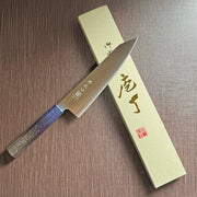 Japanese-style Kiritsuke Santoku Kitchen Knife 21cm crafted by Inoguchi Hamono in Seki, Japan with Japanese Oak handle with gradient blue urushi lacquer with box on brown background