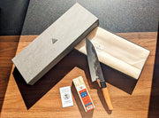Open box of Classic Santoku Kitchen Knife 200mm by Asano Blacksmith with the Amakusa Red Sharpening Stone
