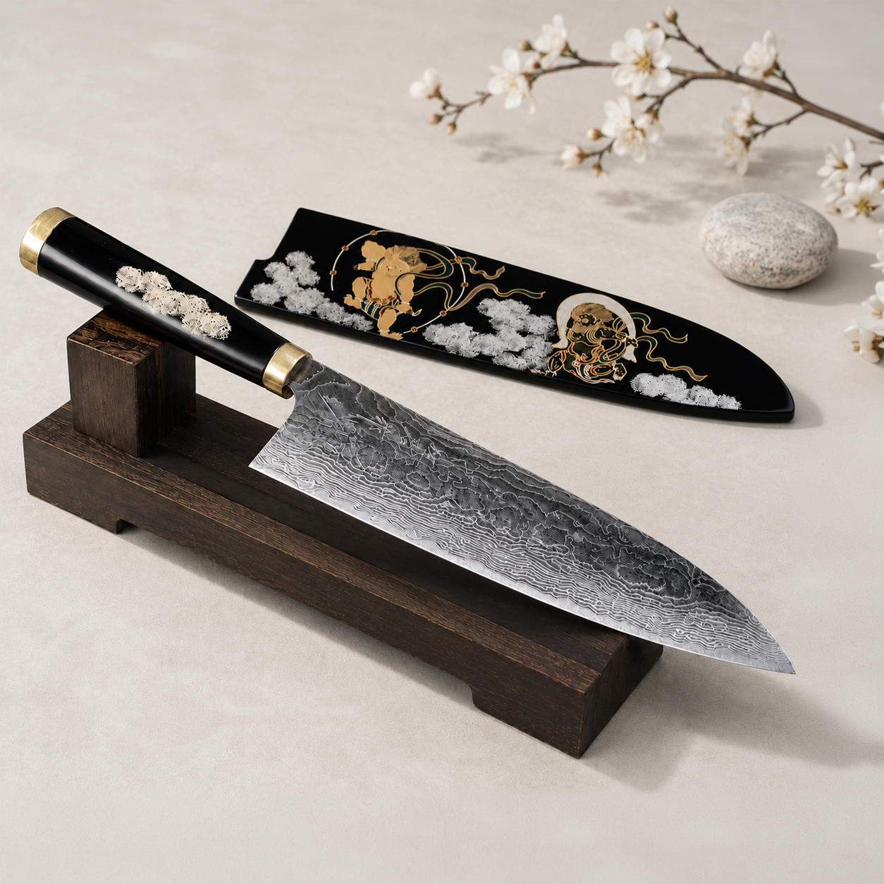 A one-of-a-kind collectors item, specifically a Takeshi Saji knife, with a handle and the accompanying saya with a graphic pattern in gold tones