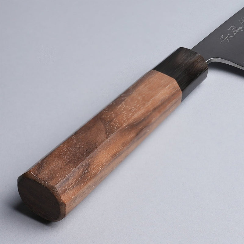 Closeup on walnut handle of Sakoda Hamono Polished Aogami Super Gyuto 180mm