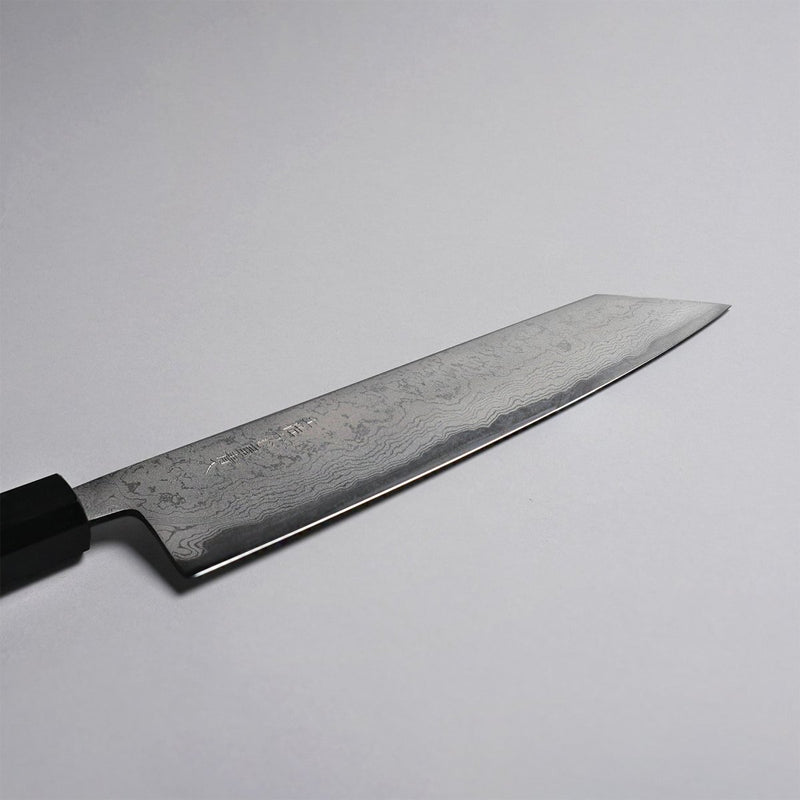 Closeup on blade of Polished Finish Damascus Blue Steel No. 2 Kiritsuke 210mm on grey background