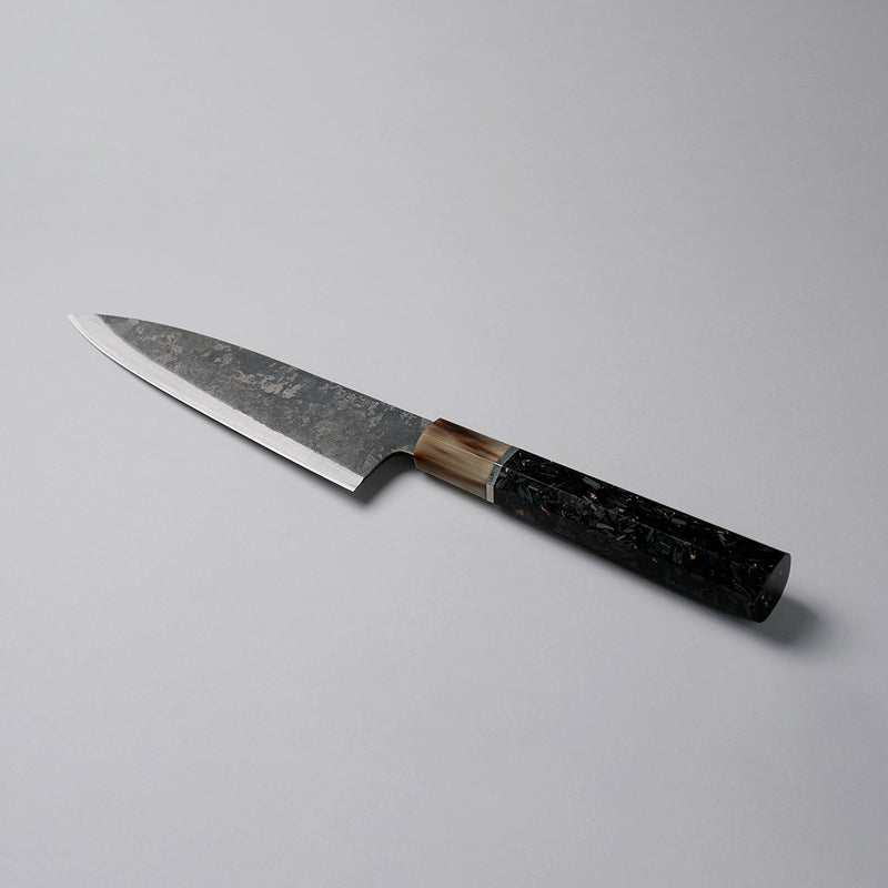 Shirou Kunimitsu Special White Steel Kurouchi Santoku Knife 170mm (Golden Leaf Ebony Handle) on a grey background