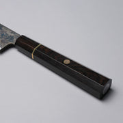 Closeup of the ebony handle of a Shirou Kunimitsu Special White Steel Kurouchi Santoku Knife 170mm