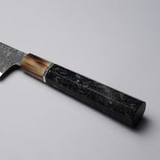 Closeup of the Golden Leaf Ebony Handle of a Shirou Kunimitsu Special White Steel Kurouchi Santoku Knife 170mm