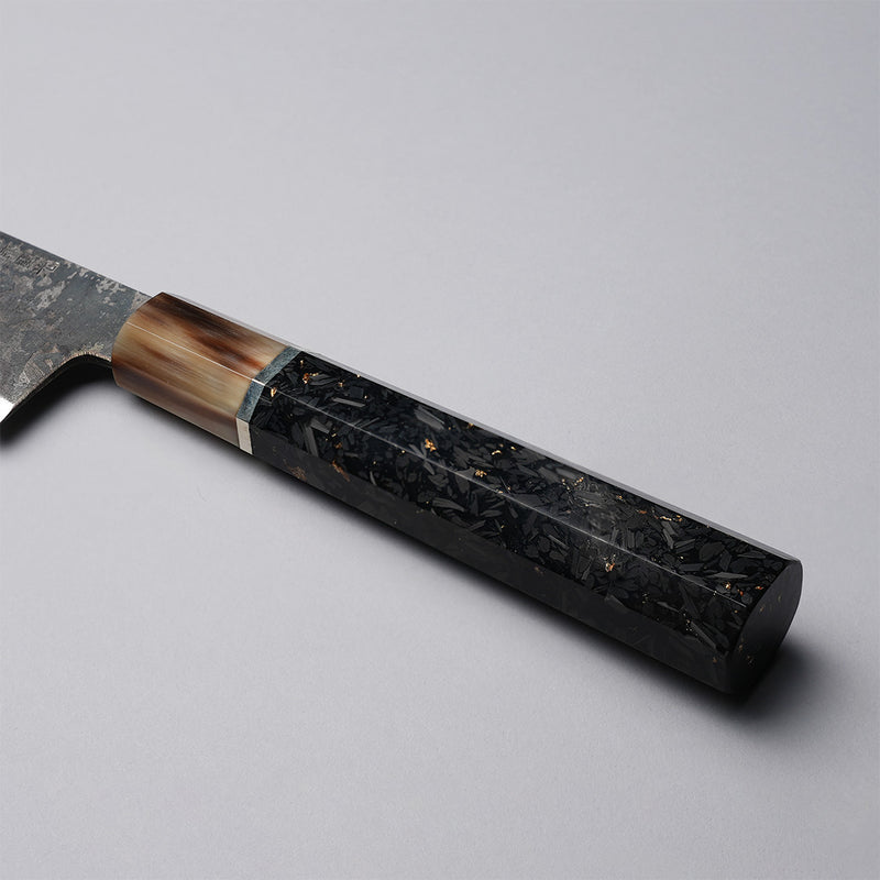 Closeup of the Golden Leaf Ebony Handle of a Shirou Kunimitsu Special White Steel Kurouchi Santoku Knife 170mm