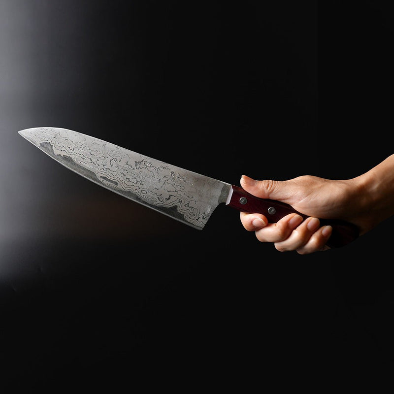 Hand holding a Nakamura Blacksmith Aogami Super Damascus Pattern Gyuto 220mm