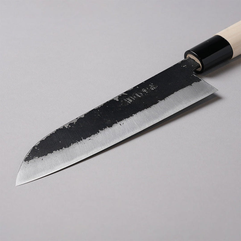 Closeup on bade of Minomo Blacksmith Santoku Knife 165mm on grey background