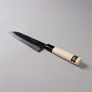 Minomo Blacksmith Santoku Knife 165mm displayed diagonally on grey background