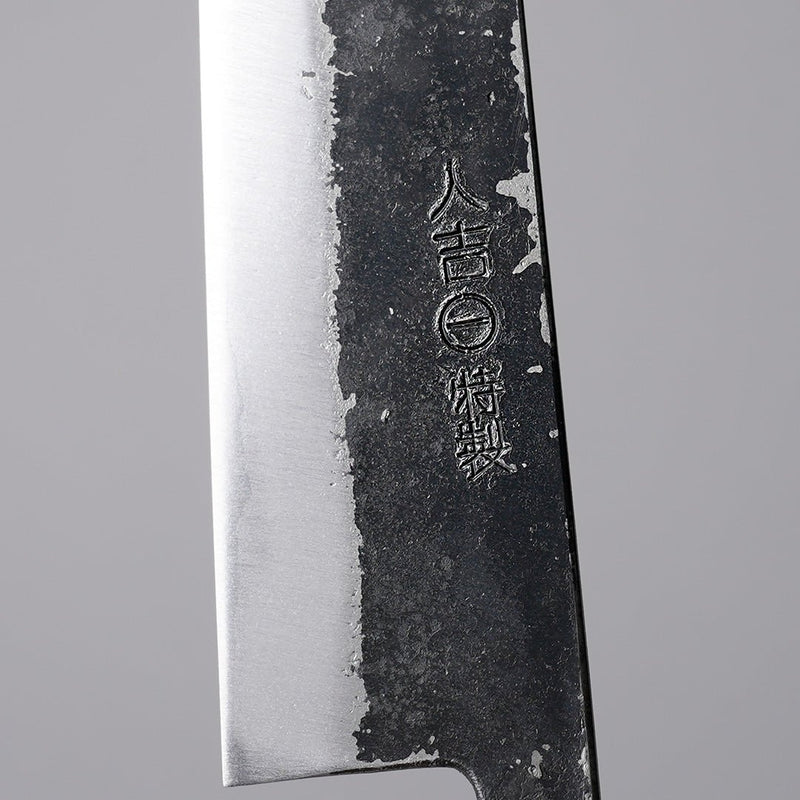 Closeup on an engraving of the smithy on Minomo Blacksmith Santoku Knife 165mm