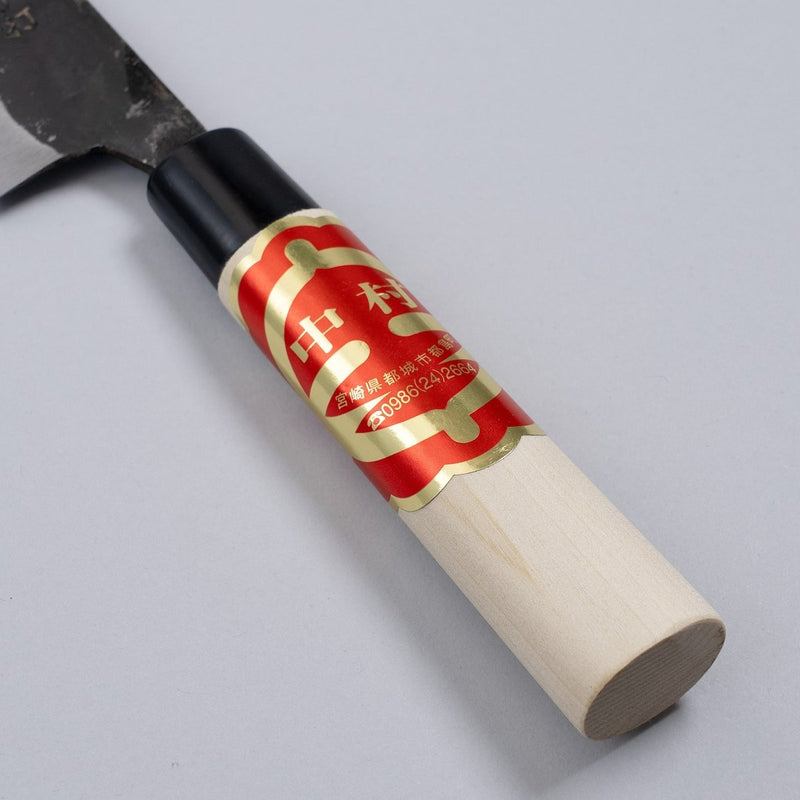 Closeup on handle of Kurouchi Santoku Knife 150mm crafted by Nakamura Blacksmith on grey background