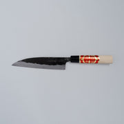 Kurouchi Santoku Knife 150mm crafted by Nakamura Blacksmith displayed horizontally on grey background