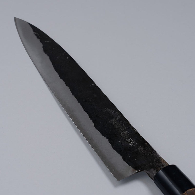 Closeup of the blade of a  Nakamura Hamono Kurouchi Sashimi Knife 240mm with maker name engraved