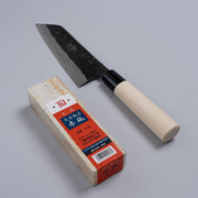 Nakamura Hamono Kurouchi Santoku Knife 165mm next to the free Amakusa red natural whetstone on a grey background